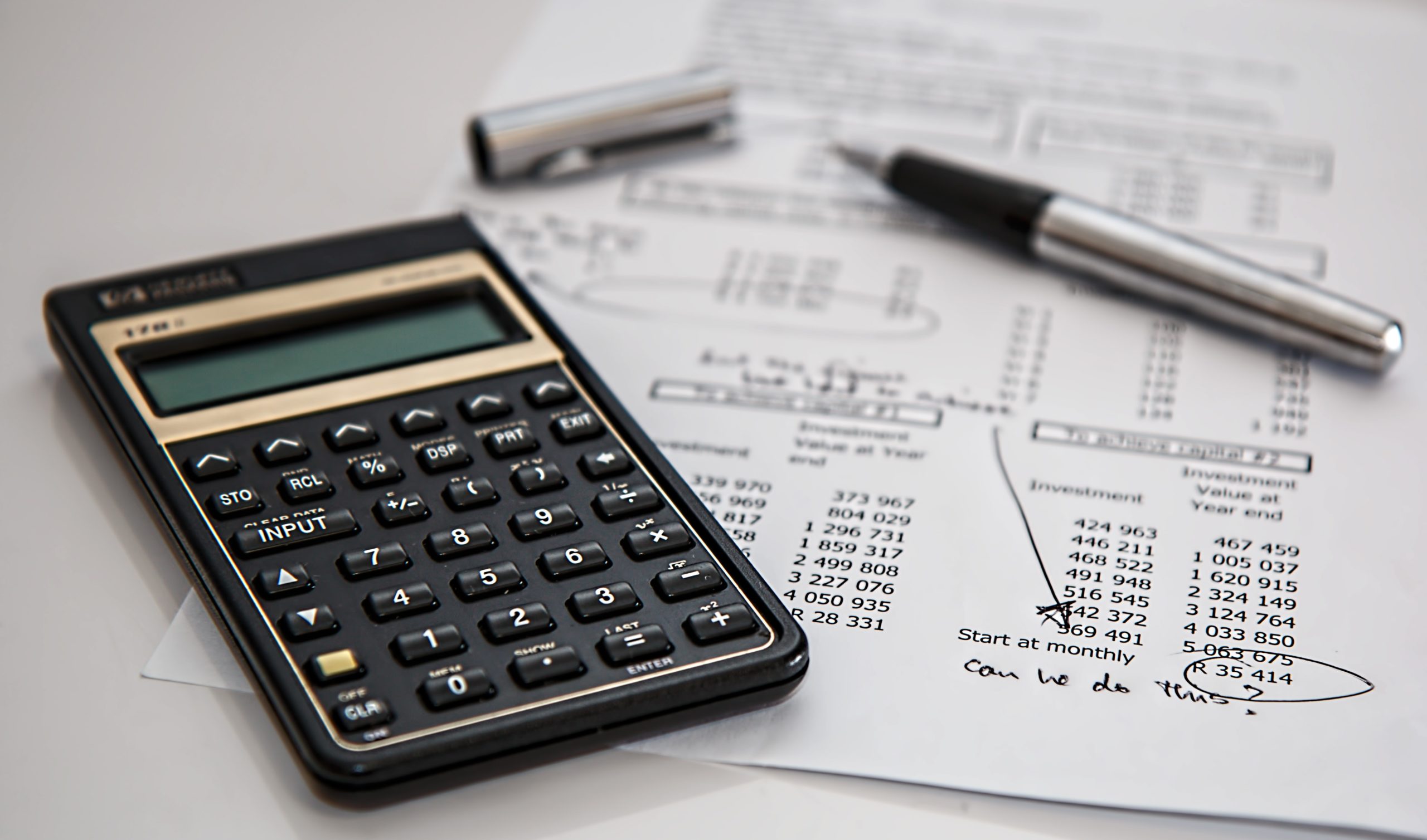 calculator and real estate financial documents
